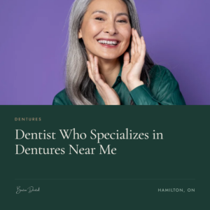 Smiling older woman with gray hair touching her face - dentist who specializes in dentures near Hamilton ON, Barton Dental