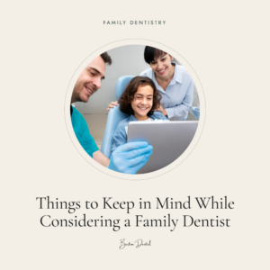 Dentist and mother smiling with young girl in dental chair holding tablet - things to consider when choosing a family dentist, Barton Dental