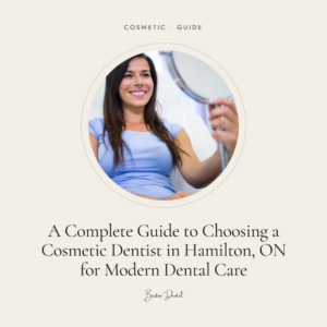 Smiling woman holding a hand mirror in dental chair - guide to choosing a cosmetic dentist in Hamilton ON, Barton Dental