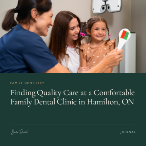 Dental hygienist and mother smiling with young girl holding an X-ray shield - family dental clinic in Hamilton ON, Barton Dental